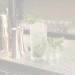 clear drinking glass with green leaves on table