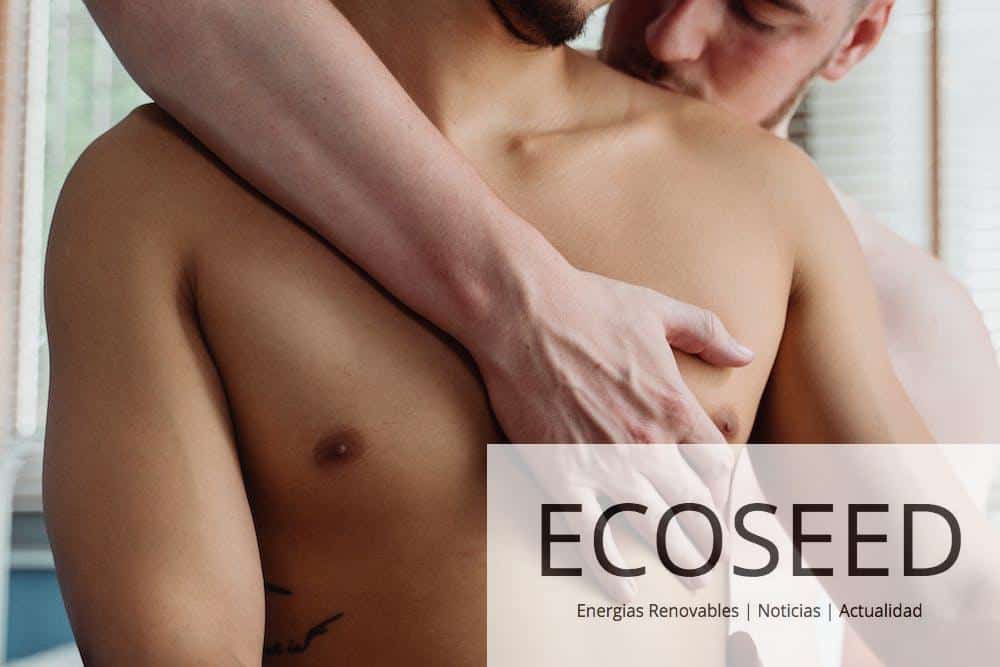 Two Topless Men Being Affectionate