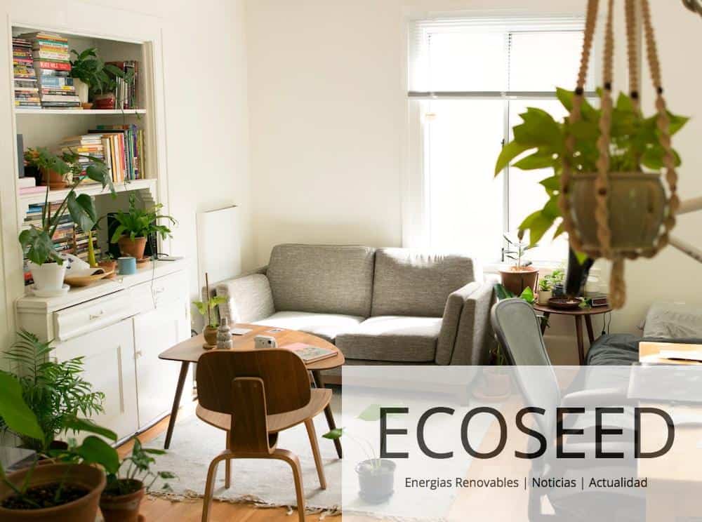 gray fabric loveseat near brown wooden table