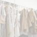 Assorted sewing patterns on hangers inside tailor atelier