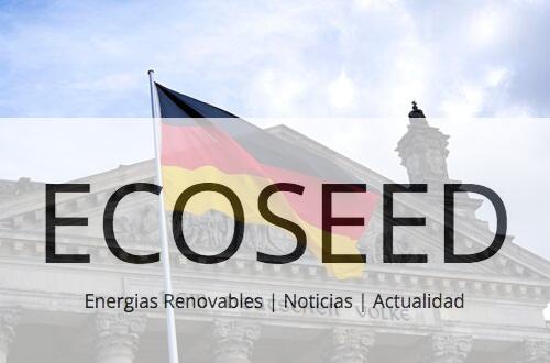 German national flag waving in front of the Reichstag building in Berlin, a symbol of democracy.